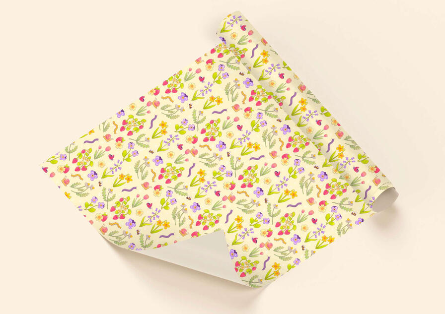 A mock-up wrapping paper of a floral garden illustrated repeat pattern.