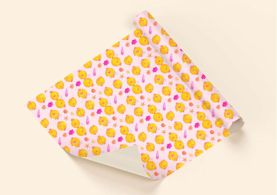 A mock-up wrapping paper of a puffer fish illustrated repeat pattern.